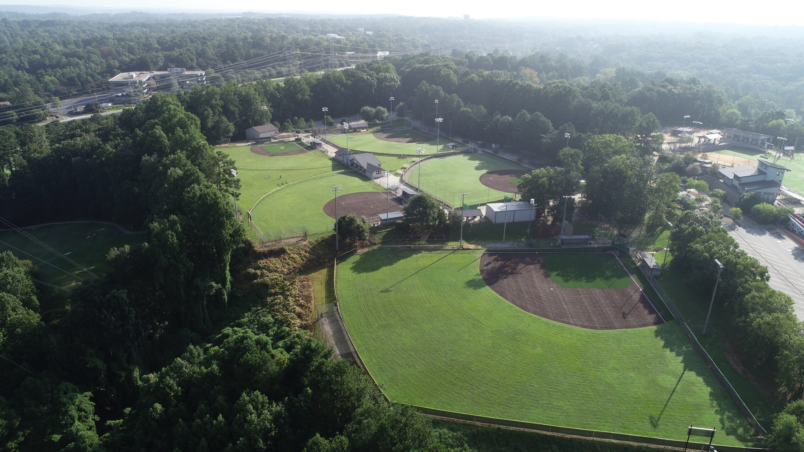 The new synthetic turf baseball field at Morgan Falls Park, with the Chattahoochee River in the background.