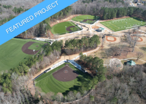 An aerial overview of the completed phases at Gresham Park, showing multiple new synthetic turf fields.