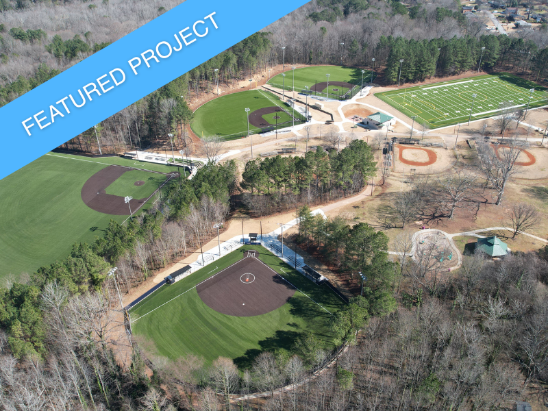 An aerial overview of the completed phases at Gresham Park, showing multiple new synthetic turf fields.
