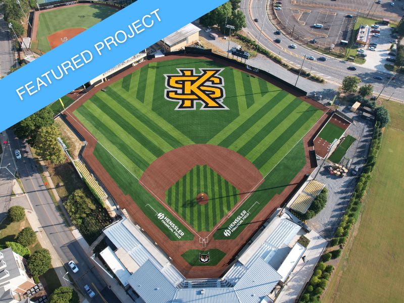 The Kennesaw State University baseball field, featuring a pristine synthetic turf infield and natural grass outfield.