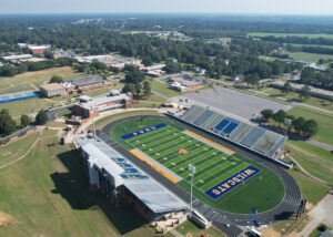 Completed synthetic turf football field at Fort Valley State University, with the FVSU Wildcats logo prominently displayed.