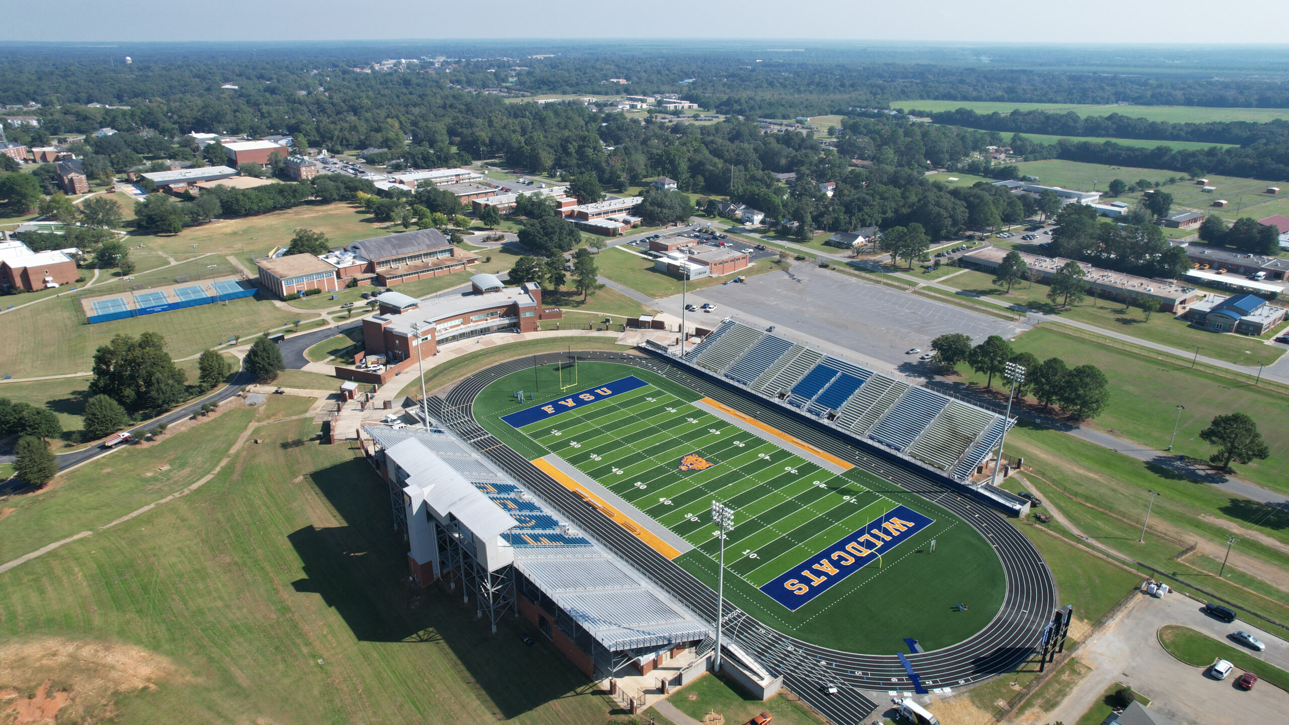 Completed synthetic turf football field at Fort Valley State University, with the FVSU Wildcats logo prominently displayed.
