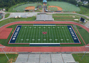 The Woodland High School football field, featuring the Wildcats logo on the new synthetic turf.