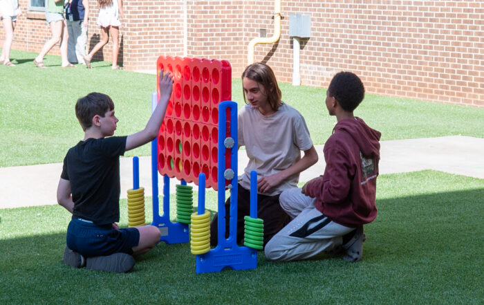 kids enjoying their new landscape turf at beacon hill middle in decatur, ga