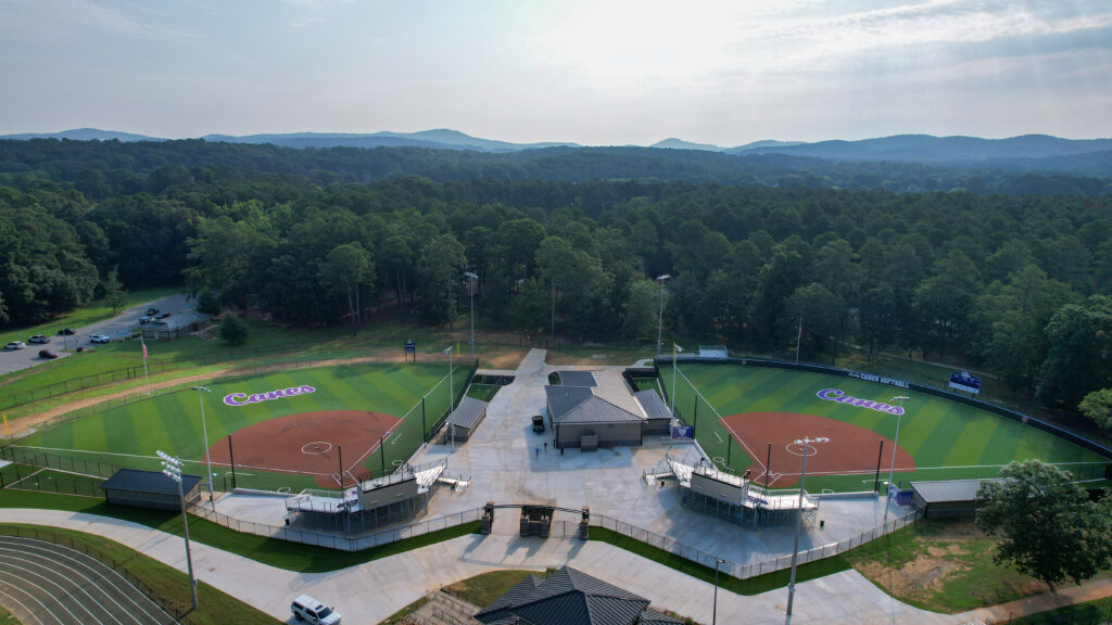 Elevated wide image showing both fields and spectator amenities.