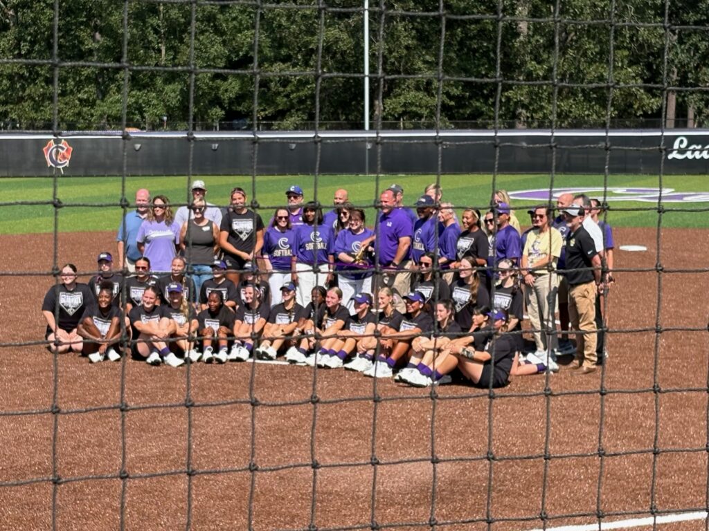 IMG_4592 Ribbon-cutting group photo with players, supporters, and the new facility behind them